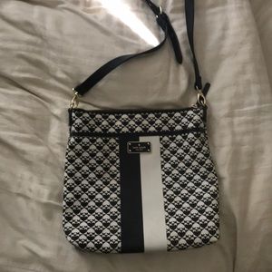 Kate spade crossbody bag with bright pink lining.